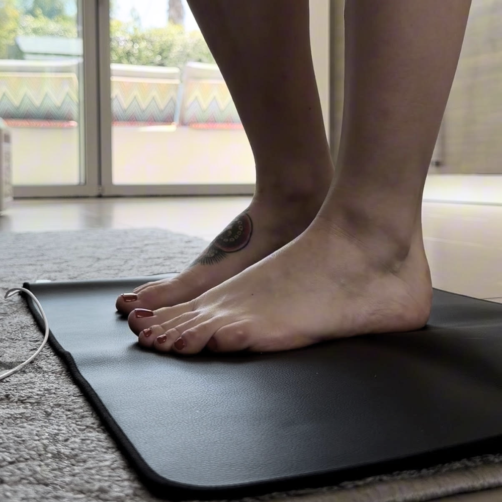 woman-and-grounding-mat